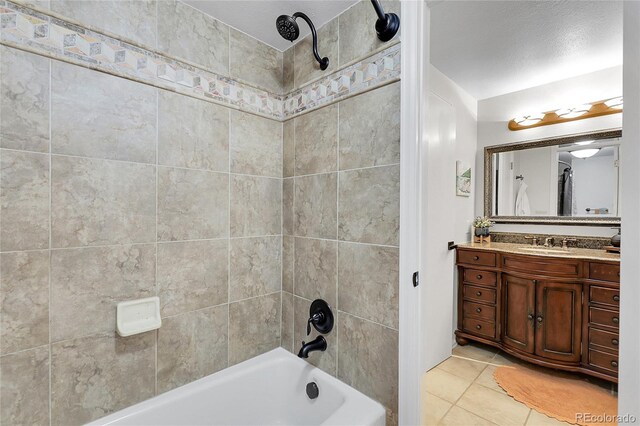 bathroom with shower / bathtub combination, tile patterned floors, and vanity