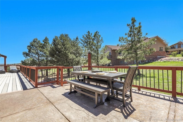 view of patio / terrace featuring outdoor dining area and a wooden deck