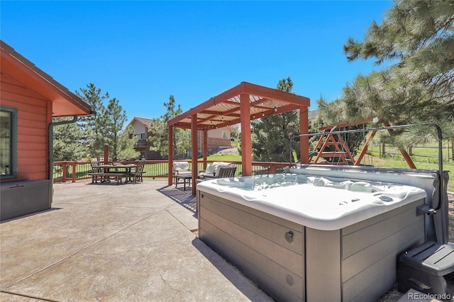 view of patio / terrace featuring outdoor dining area and a hot tub