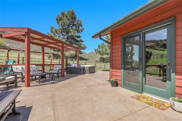 view of patio / terrace featuring an outdoor hangout area, fence, and a pergola