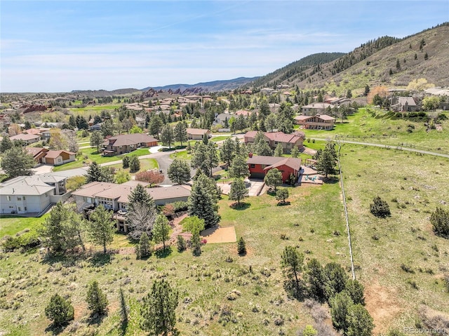 drone / aerial view with a mountain view and a residential view