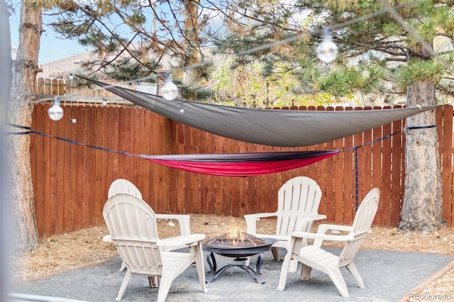 view of patio / terrace with a fire pit