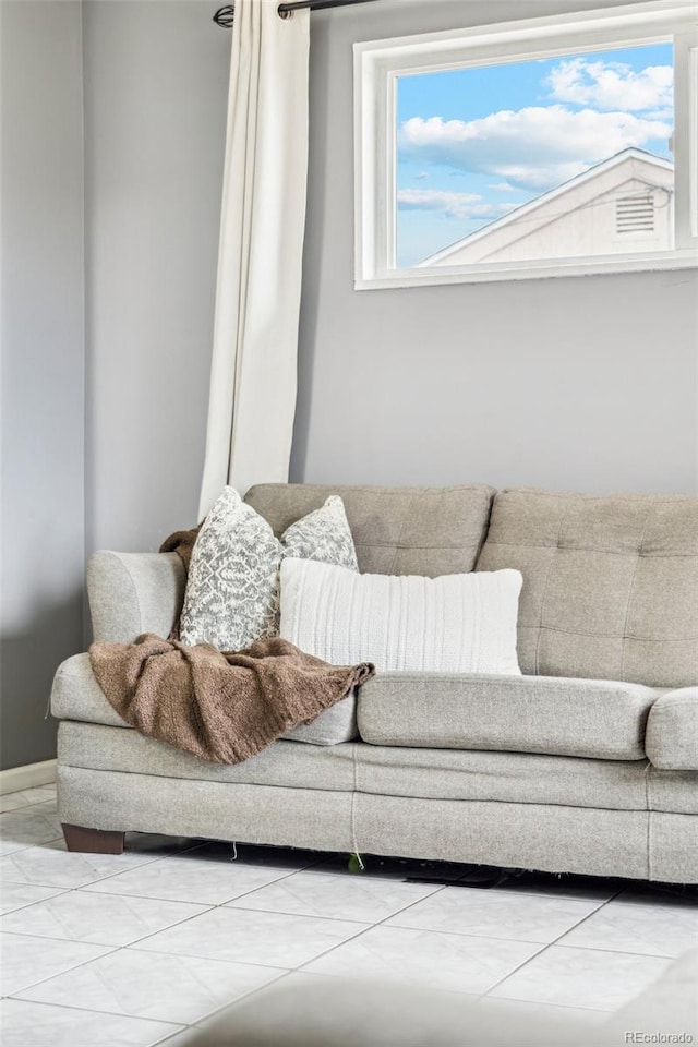 living room with tile patterned floors