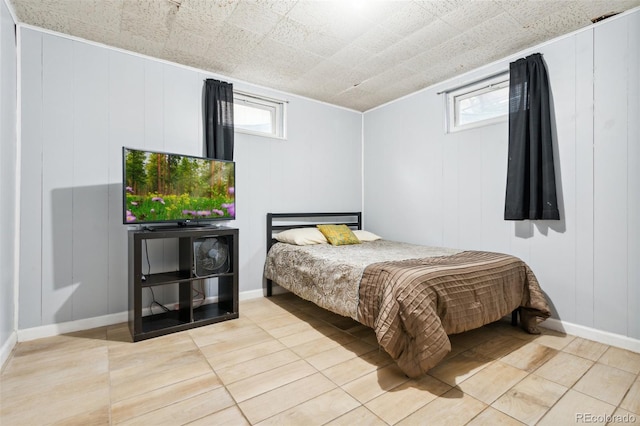 bedroom with light tile patterned floors