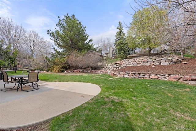 view of yard featuring a patio and fence