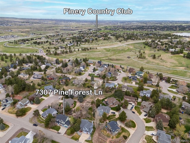 birds eye view of property with a residential view