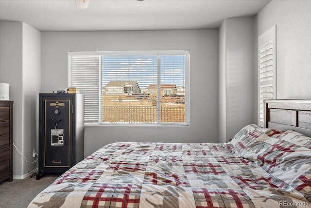 bedroom with carpet floors and baseboards