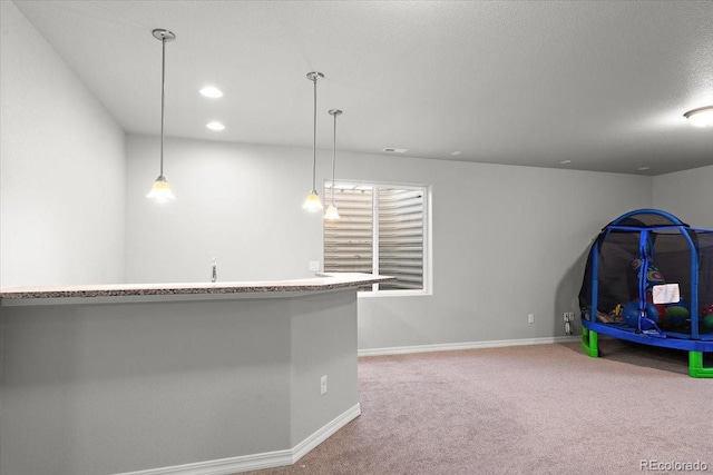 rec room with wet bar, baseboards, carpet flooring, and recessed lighting