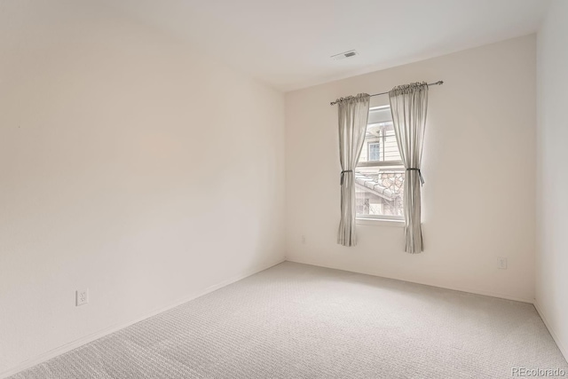 unfurnished room with carpet flooring