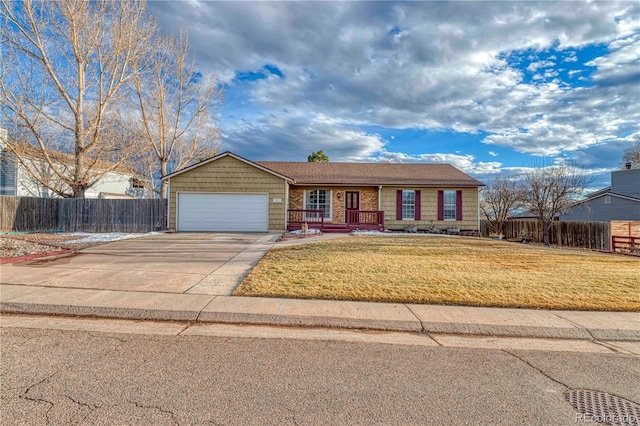 ranch-style home with a garage, driveway, a front yard, and fence