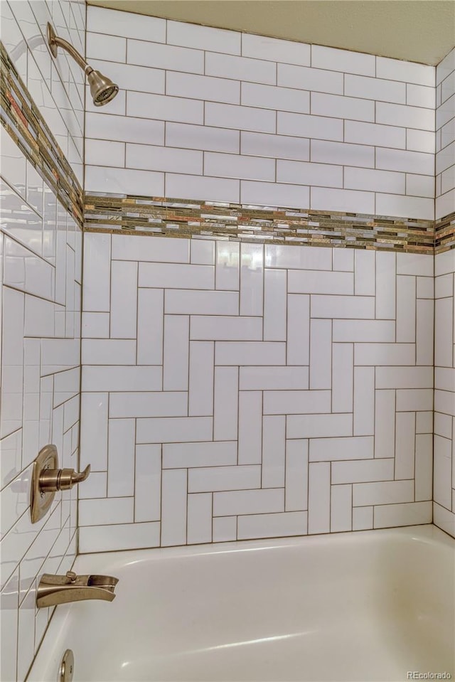 bathroom with shower / bathing tub combination