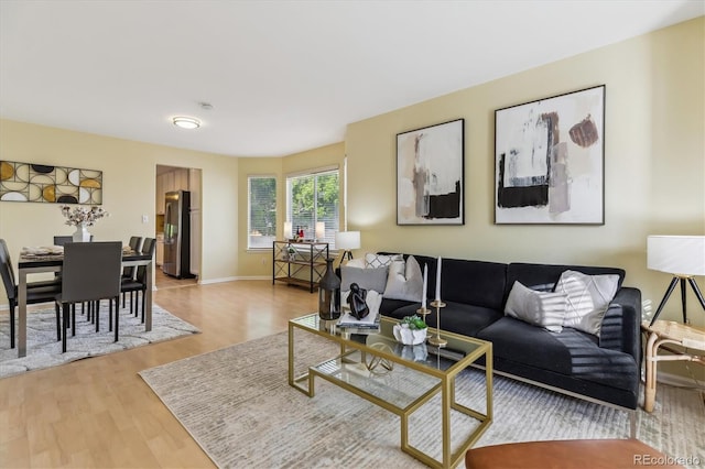 15597 E Dorado Ave, Centennial, CO 80015 - living area featuring light wood-style flooring and baseboards