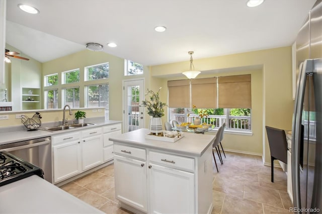 15597 E Dorado Ave, Centennial, CO 80015 - kitchen featuring a sink, white cabinetry, hanging light fixtures, light countertops, and recessed lighting
