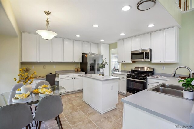 15597 E Dorado Ave, Centennial, CO 80015 - kitchen featuring stainless steel appliances, a sink, white cabinetry, and recessed lighting