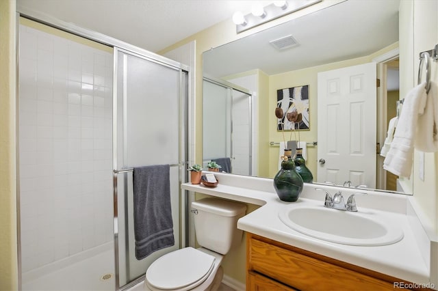 15597 E Dorado Ave, Centennial, CO 80015 - bathroom featuring toilet, a shower stall, and vanity