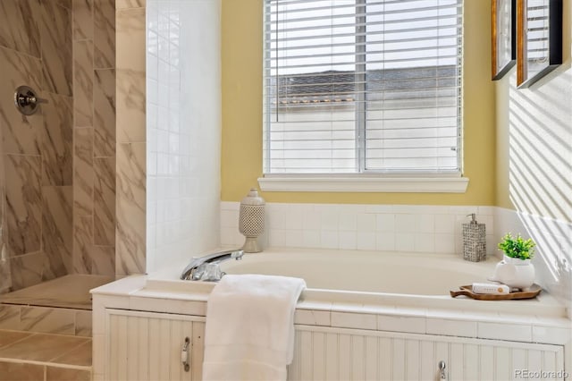 15597 E Dorado Ave, Centennial, CO 80015 - bathroom featuring a bath, plenty of natural light, and a tile shower