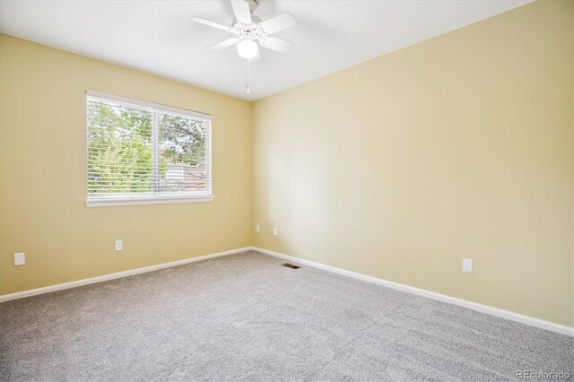 15597 E Dorado Ave, Centennial, CO 80015 - spare room featuring carpet, ceiling fan, and baseboards