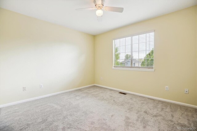 15597 E Dorado Ave, Centennial, CO 80015 - carpeted spare room featuring baseboards and ceiling fan