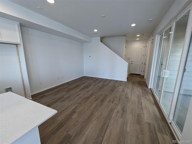 basement featuring dark hardwood / wood-style floors