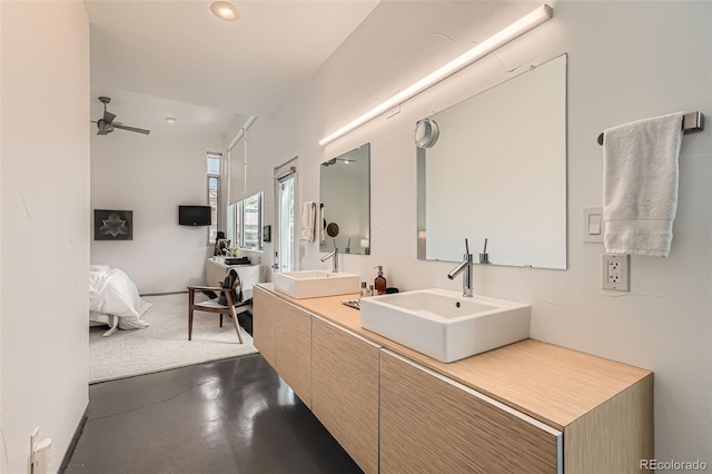3850 Vallejo St, Denver, CO 80211 - full bath with double vanity, finished concrete floors, ceiling fan, recessed lighting, and connected bathroom