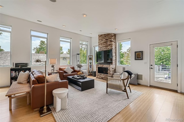 3850 Vallejo St, Denver, CO 80211 - living area featuring light wood-style floors, a fireplace, and recessed lighting
