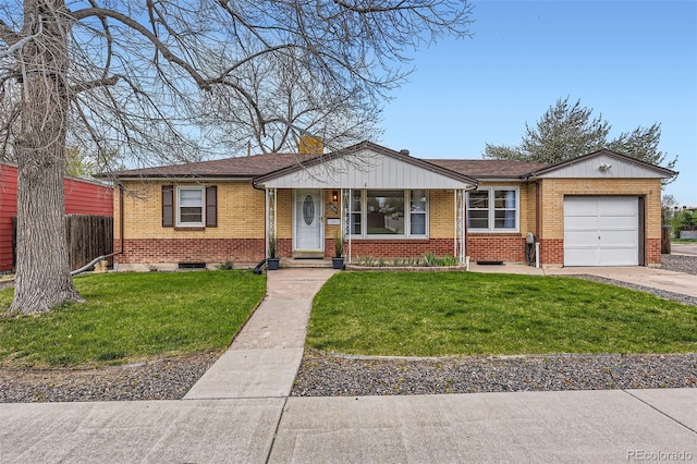 ranch-style home featuring an attached garage, brick siding, and a front yard