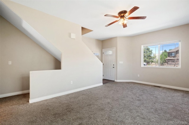 1510 York Rd Unit 100, Colorado Springs, CO 80918 - unfurnished living room featuring carpet, ceiling fan, and baseboards