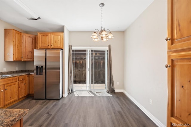 1510 York Rd Unit 100, Colorado Springs, CO 80918 - kitchen featuring stainless steel refrigerator with ice dispenser, dark wood-type flooring, a chandelier, and baseboards