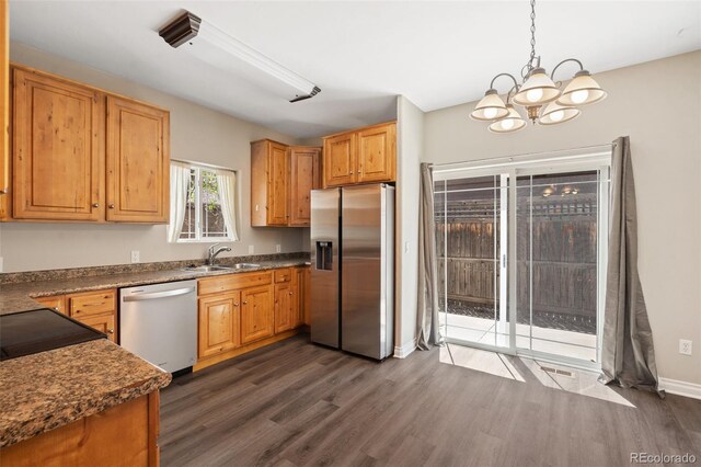 1510 York Rd Unit 100, Colorado Springs, CO 80918 - kitchen featuring stainless steel appliances, dark wood finished floors, a chandelier, and dark countertops