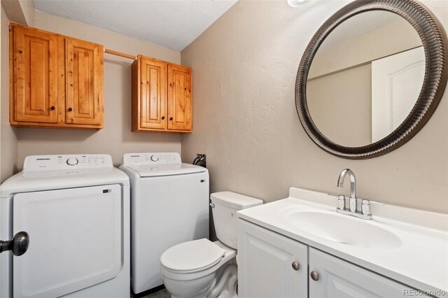 1510 York Rd Unit 100, Colorado Springs, CO 80918 - bathroom featuring independent washer and dryer, toilet, and vanity