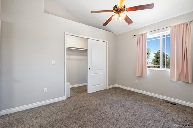 1510 York Rd Unit 100, Colorado Springs, CO 80918 - unfurnished bedroom featuring carpet, a closet, vaulted ceiling, baseboards, and a ceiling fan