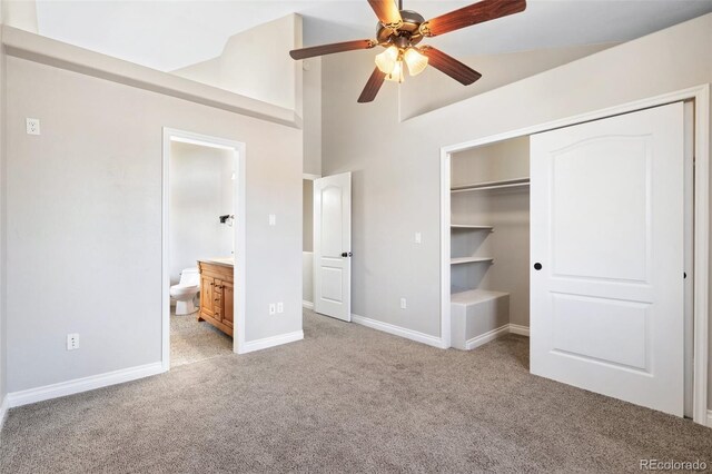 1510 York Rd Unit 100, Colorado Springs, CO 80918 - unfurnished bedroom with light carpet, high vaulted ceiling, baseboards, a closet, and ensuite bathroom