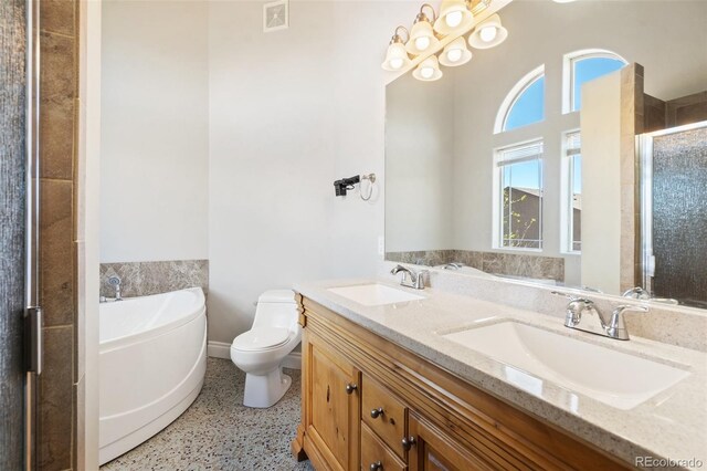 1510 York Rd Unit 100, Colorado Springs, CO 80918 - bathroom featuring speckle patterned floor, a garden tub, toilet, double vanity, and a shower stall