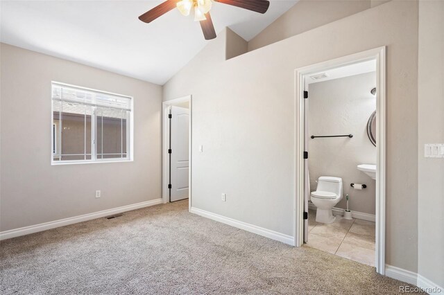 1510 York Rd Unit 100, Colorado Springs, CO 80918 - unfurnished bedroom with vaulted ceiling, carpet flooring, ensuite bath, baseboards, and a ceiling fan