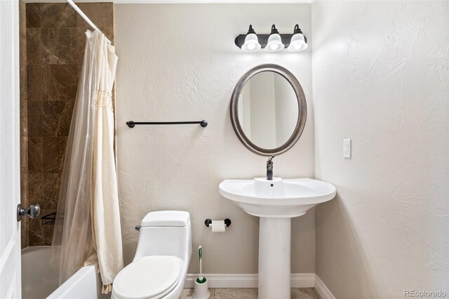 1510 York Rd Unit 100, Colorado Springs, CO 80918 - bathroom with toilet and shower / bathtub combination with curtain