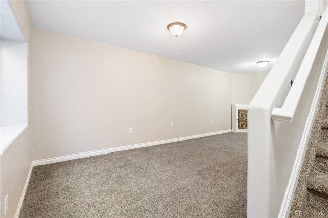 1510 York Rd Unit 100, Colorado Springs, CO 80918 - carpeted spare room featuring stairs and baseboards