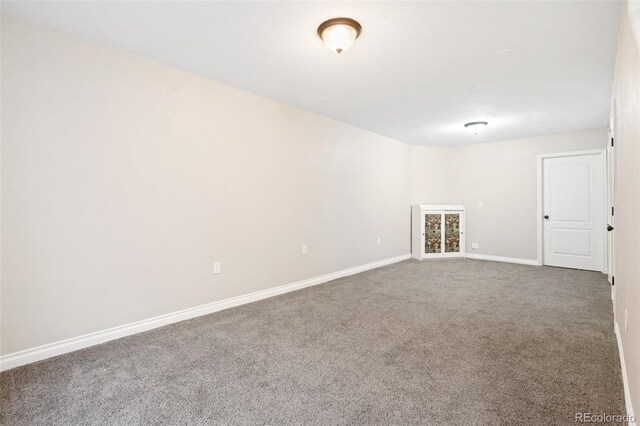 1510 York Rd Unit 100, Colorado Springs, CO 80918 - empty room featuring carpet floors and baseboards