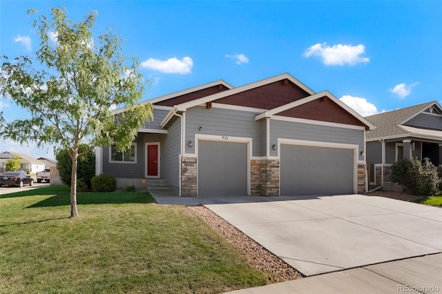 craftsman-style house featuring a front yard and a garage