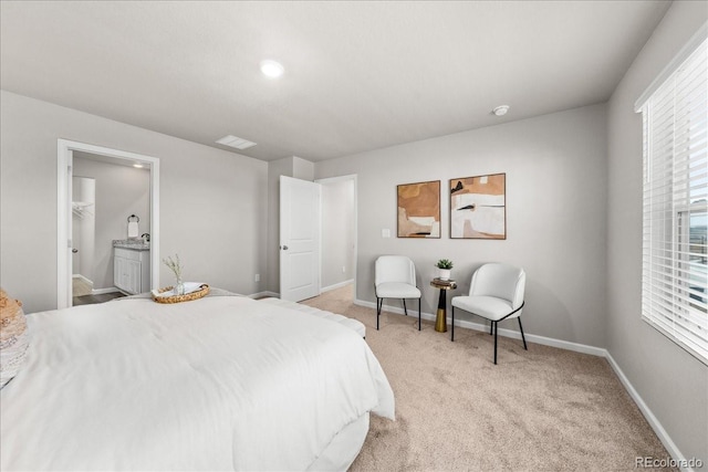 bedroom with light carpet, ensuite bath, visible vents, and baseboards