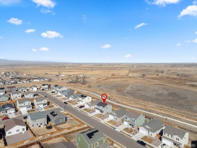 birds eye view of property with a residential view