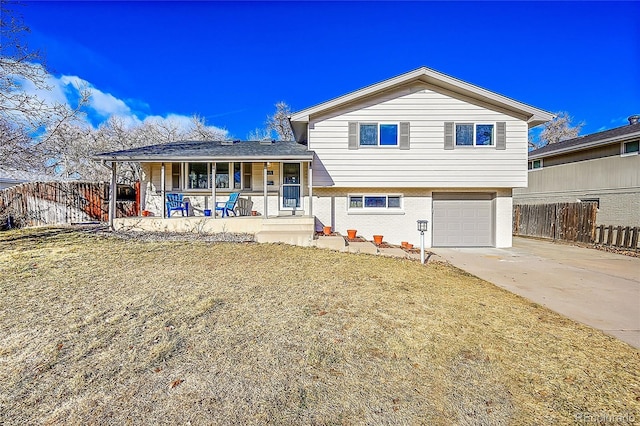 view of front of house featuring a porch and a garage