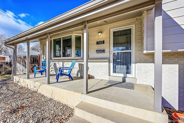 property entrance featuring covered porch