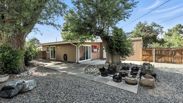 2829 Illinois Ave, Colorado Springs, CO 80907 - rear view of house with a patio area and a gate