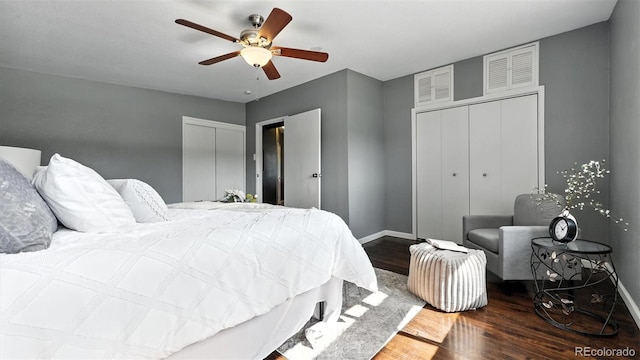 2829 Illinois Ave, Colorado Springs, CO 80907 - bedroom with wood finished floors, a ceiling fan, and two closets