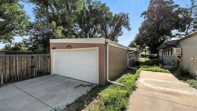 2829 Illinois Ave, Colorado Springs, CO 80907 - detached garage featuring a wall mounted air conditioner