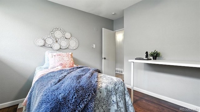2829 Illinois Ave, Colorado Springs, CO 80907 - bedroom featuring baseboards and wood finished floors
