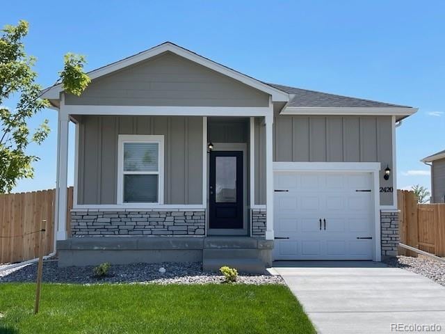 ranch-style house with a garage and a front yard