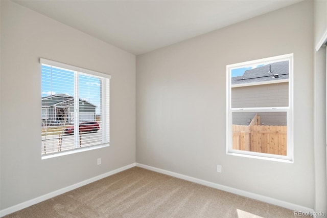 unfurnished room with carpet floors