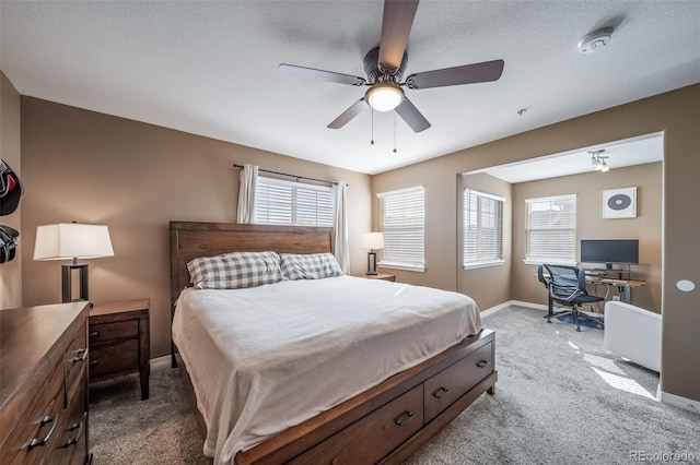 bedroom with baseboards, ceiling fan, and carpet flooring