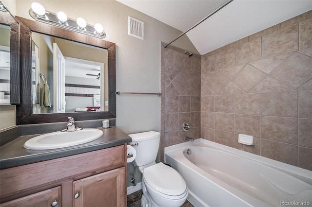 bathroom with tub / shower combination, visible vents, toilet, and vanity